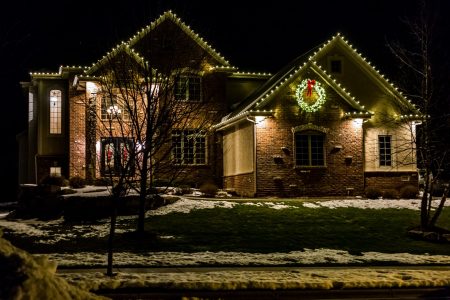 This is a photo of a home roofline covered in holiday lights.
